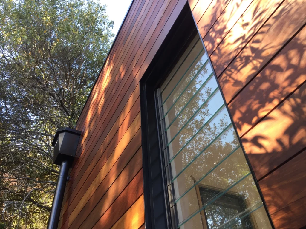 Timber exterior and glass louvre window of an extension in Lilyfield.