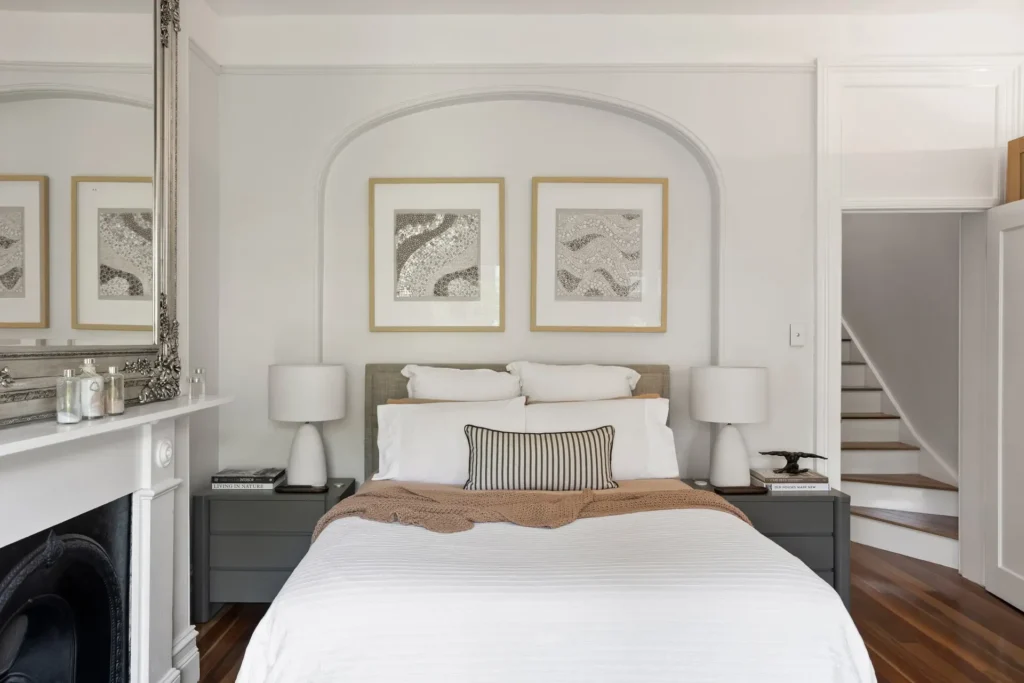 Bedroom with fireplace in a heritage renovation in Surry Hills.